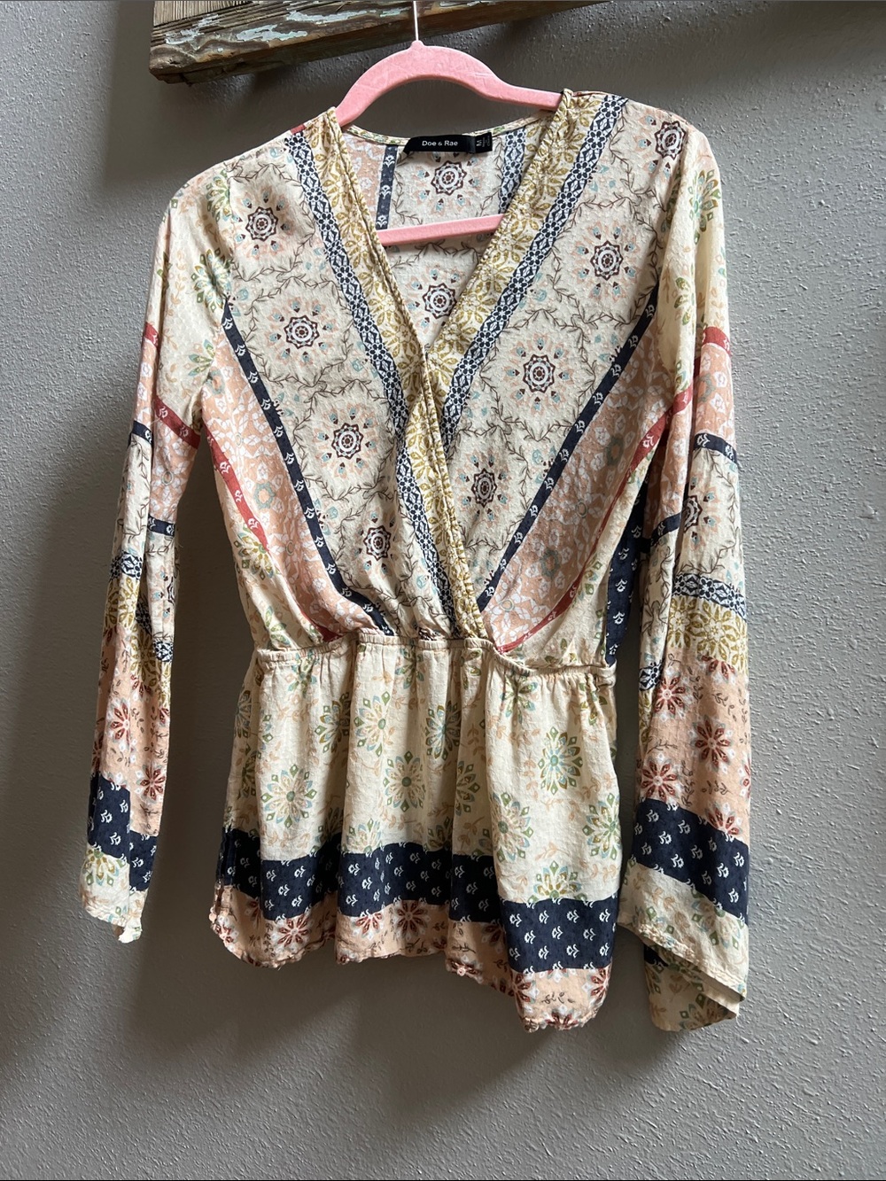 Doe & Rae Cream Multi-Pattern V-Neck Peplum Top